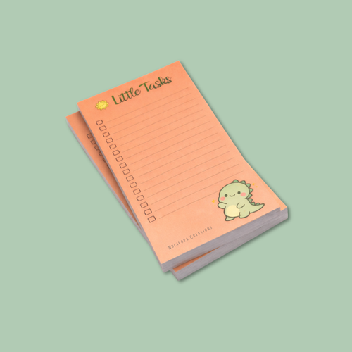 Notepad with dinosaur illustration on a light green background